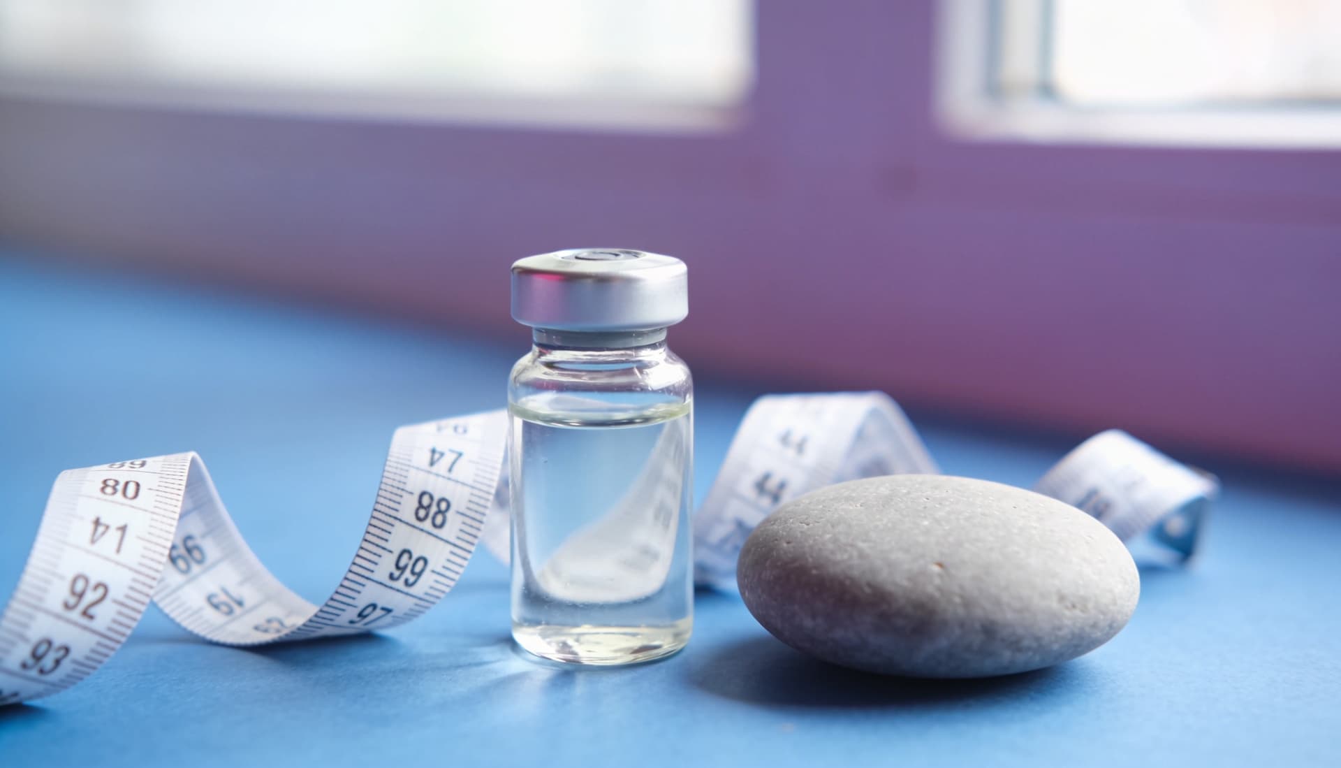 GLP-1 peptide vial with a measuring tape